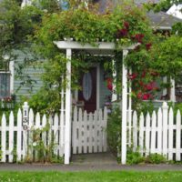 White fence in the front garden of the cottage