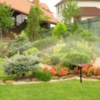 Watering an alpine slide from sprinklers