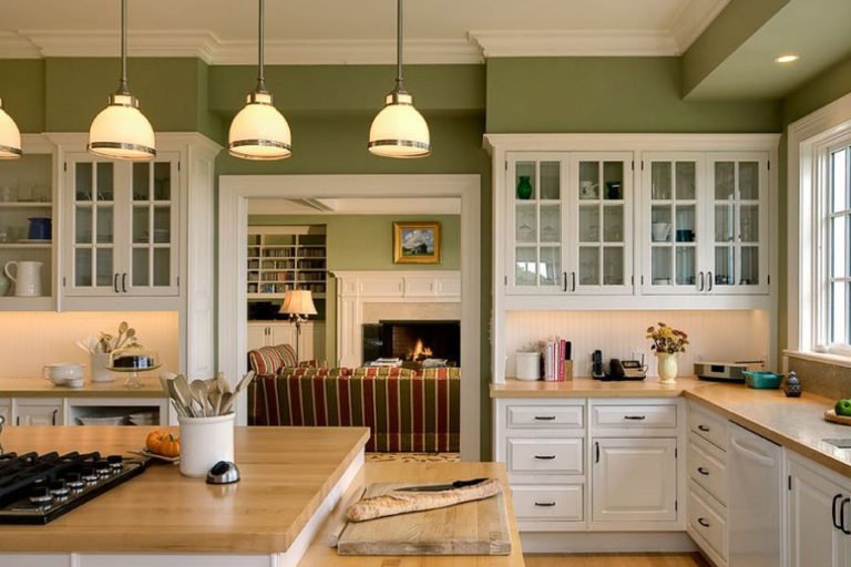 Kitchen interior with white set and olive walls