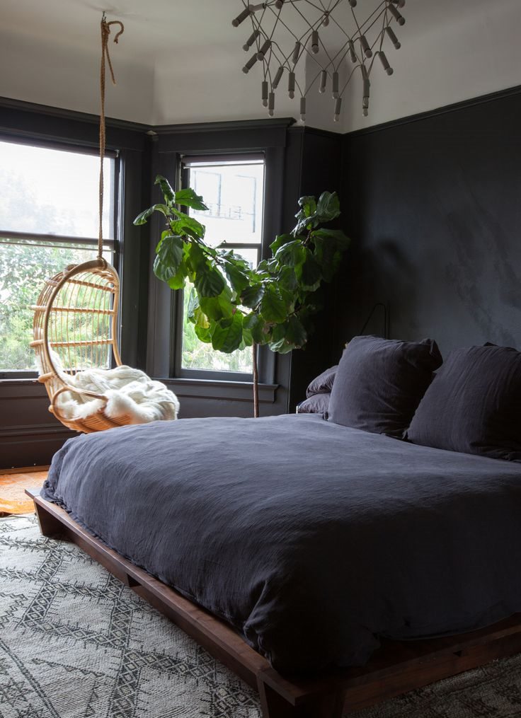 The interior of the bedroom with dark furniture in the Gothic style