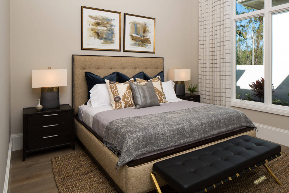 Beautiful bedroom with lights on the bedside tables