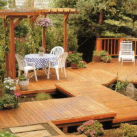 Rest area with a boardwalk on the slope of a summer cottage