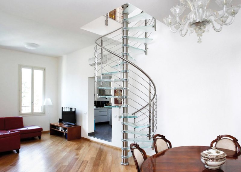 Hall of a private house with a spiral staircase of light construction