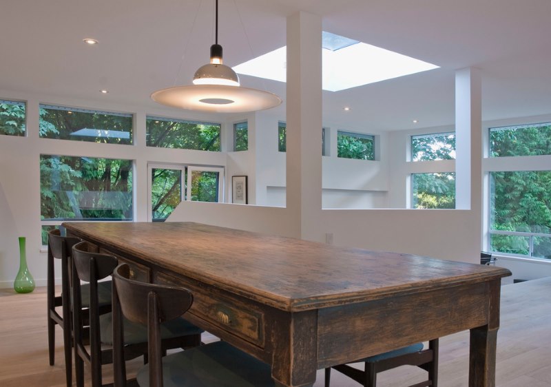 Farm style antique table in a modern living room.