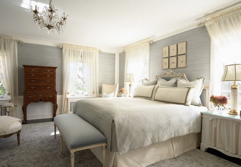 Textiles in pastel colors in the decoration of a classic bedroom