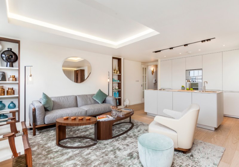 Interior of a white kitchen-living room in a private house