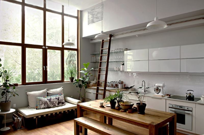 Large windows in the kitchen-living room with a high ceiling