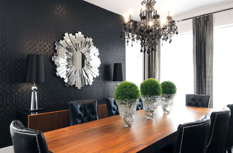 Black chandelier in the interior of a dark living room