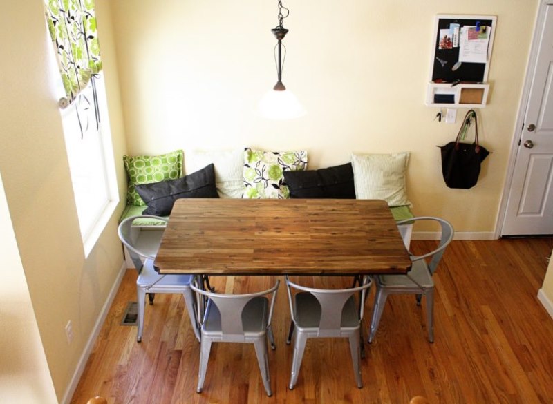 Dining table with wooden countertop in the kitchen of a country house.