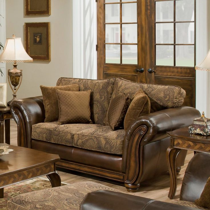 Leather brown sofa on a background of a wooden door