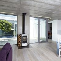 A wood-burning boiler in the living room of a country house