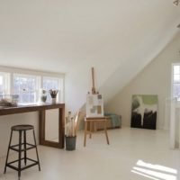 Wooden table in a white room