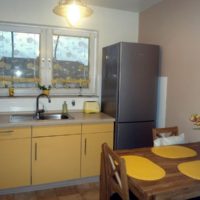 Sink instead of window sill in the kitchen of a private house