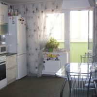 Modern kitchen with door to the balcony