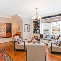 Colorful carpet on the wooden floor of the living room