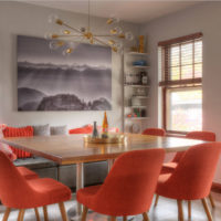 Red chairs at the dining table in the living room