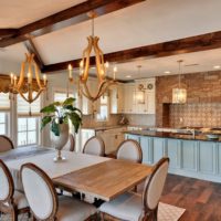 Wooden chandelier in the design of the living room