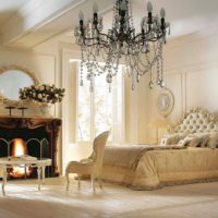 Black chandelier in the bedroom with cream walls