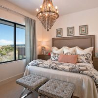 Cone-shaped chandelier in the bedroom of a city apartment