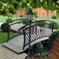 Forged bridge over a stream in the garden