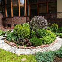 Ball of willow twigs on a flowerbed of a garden plot