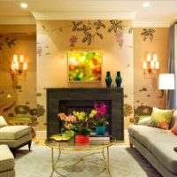 Living room interior with fireplace and floral wallpaper.