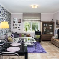 Highlighting the wall with floral wallpaper in the living room interior