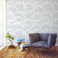 Floral ornaments on the wallpaper in the living room of a city apartment