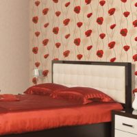 Red poppies on the wallpaper in the bedroom