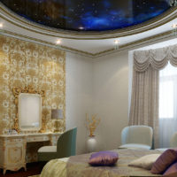 Decoration of accent on the wall using wallpaper with gilding