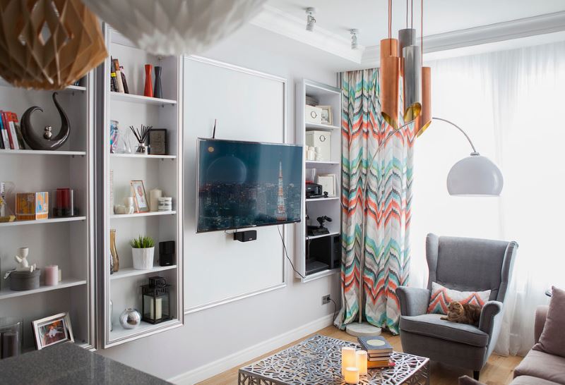 The interior of a small living room in bright colors