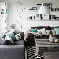 Gray in the living room interior with mint pillows