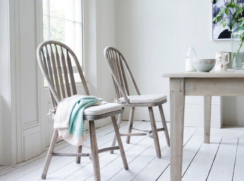 Provence style chairs near the window in the kitchen-living room