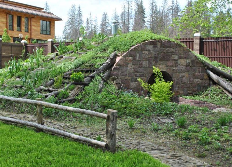 Modern cellar as a small architectural form in the garden