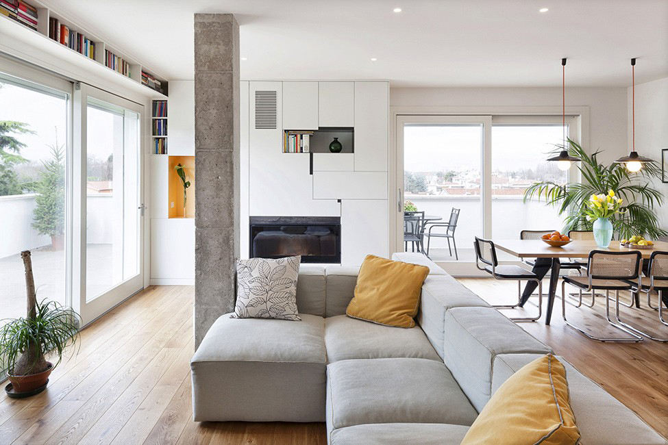 Concrete column with rough surface in the living room interior