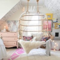 Hanging chair in the interior of the room for a teenager