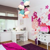 Multi-colored lampshades on a chandelier in a children's room