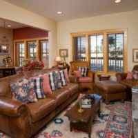 Living room of a country house with brown upholstered furniture