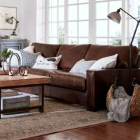 Panoramic windows behind the sofa in the living room