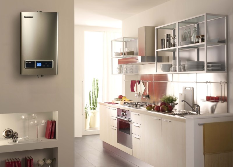 Stainless steel boiler on the kitchen wall