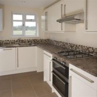 Small kitchen in a country house with a geyser