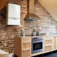 White gas boiler on a brick wall