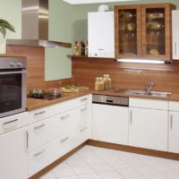 Gas boiler with a white body in the kitchen of a city apartment