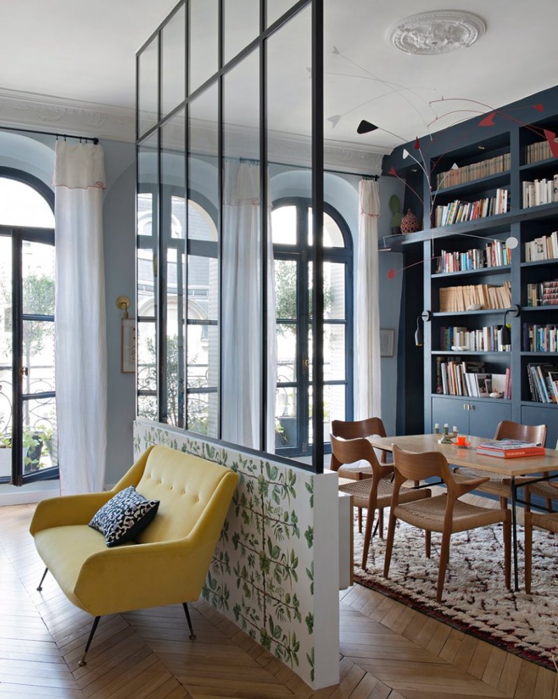 Interior decoration of the living room with a glass partition