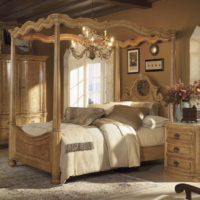 Wooden bed in the bedroom of a country house