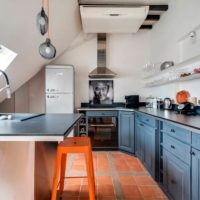 Ceramic tiles on the kitchen floor in the attic