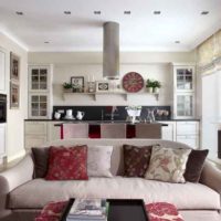 Pillows on a gray sofa in the interior of the kitchen-living room