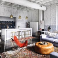 Leather pouf-table in the center of the kitchen-living room