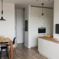 Lunchy wooden table with white walls