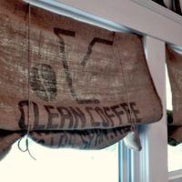 Inscriptions on natural burlap curtains